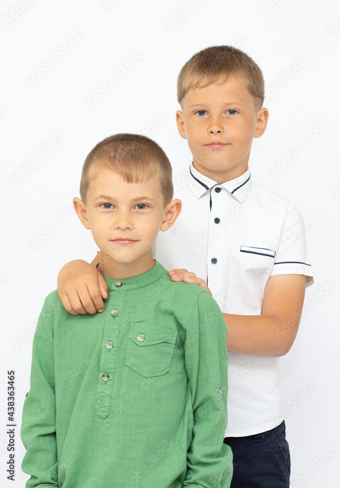 two happy brothers on white background two happy brothers on white background