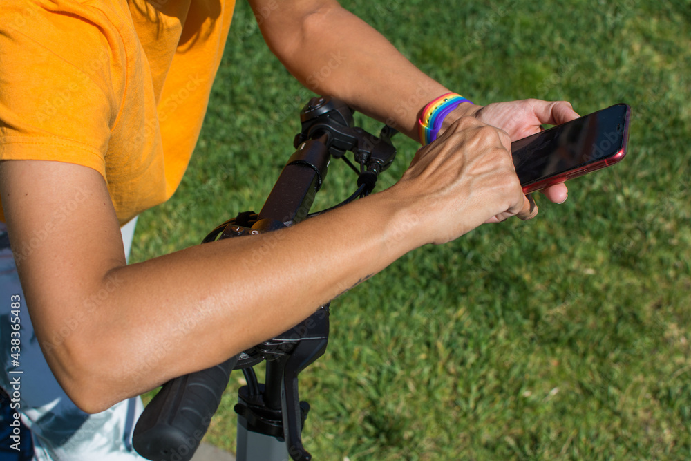 Woman Unlocking An Electric Scooter.
Closeup Of A Woman Using Her Smartphone To Pay And Unlock On Electric Scooter On A City Park Woman Unlocking An Electric Scooter.
Closeup Of A Woman Using Her Smartphone To Pay And Unlock On Electric Scooter On A City Park
