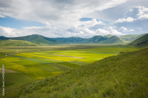 Panoramic view of cultivation of lentils in Castelluccio di Norcia plain Sibillini Mountains National Park in Umbria Region Italy