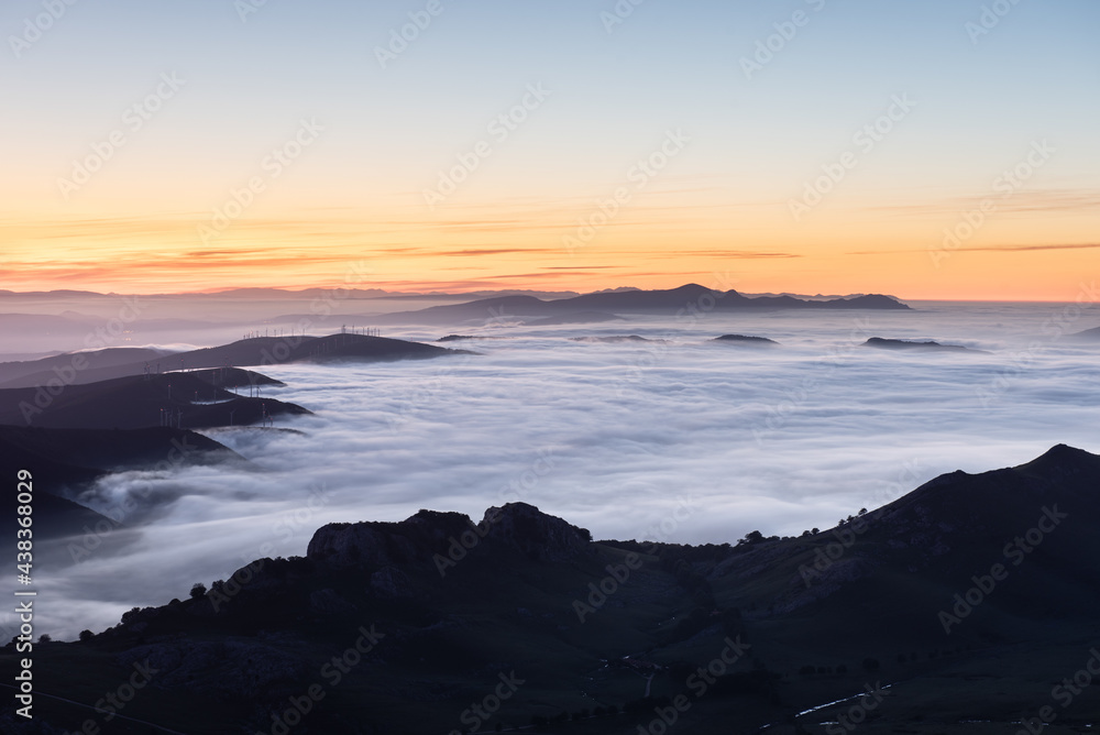 Colorful sunset over clouds at mountains Colorful sunset over clouds at mountains