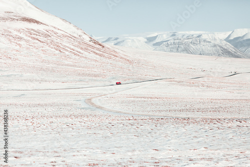 Red lorry in endless winter valley