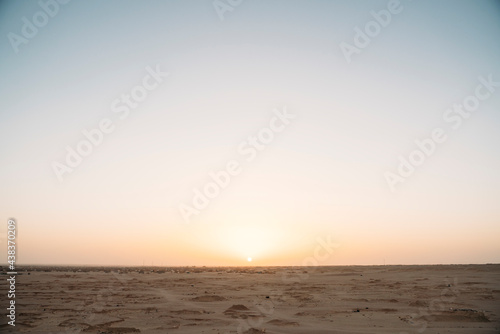 Sunset sky over arid desert photo