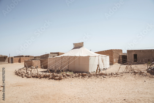 Cloudless sky over refugee camp photo