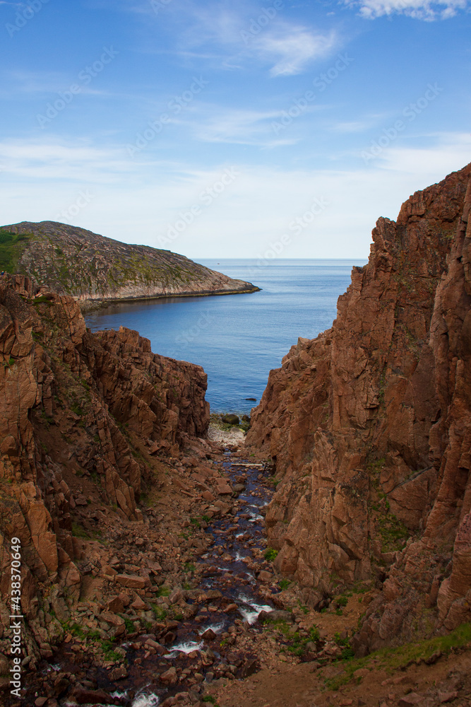 Landscapes of the Murmansk region. Waterfall on Small Battery Lake, Teriberka, Russia. Landscapes of the Murmansk region. Waterfall on Small Battery Lake, Teriberka, Russia.