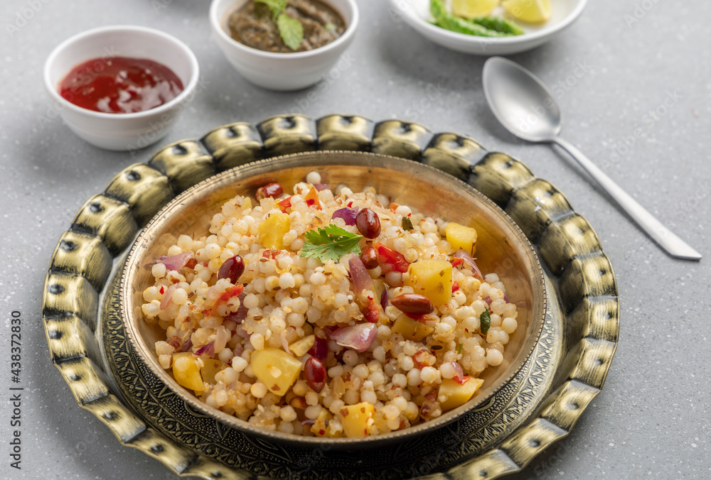 Sabudana khichdi is an Indian dish made from soaked sago or tapioca pearls Sabudana khichdi is an Indian dish made from soaked sago or tapioca pearls