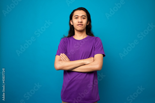 Long hair young man with smart thinking gesture, using t-shirt ,isolated background. 