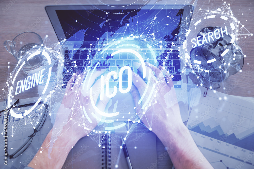 Double exposure of man's hands typing over computer keyboard and crypto currency theme hologram drawing. Top view. Blockchain concept. Double exposure of man's hands typing over computer keyboard and crypto currency theme hologram drawing. Top view. Blockchain concept.
