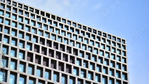 Abstract image of looking up at modern glass and concrete building. Architectural exterior detail of office building. Industrial art and detail. Sunrise.