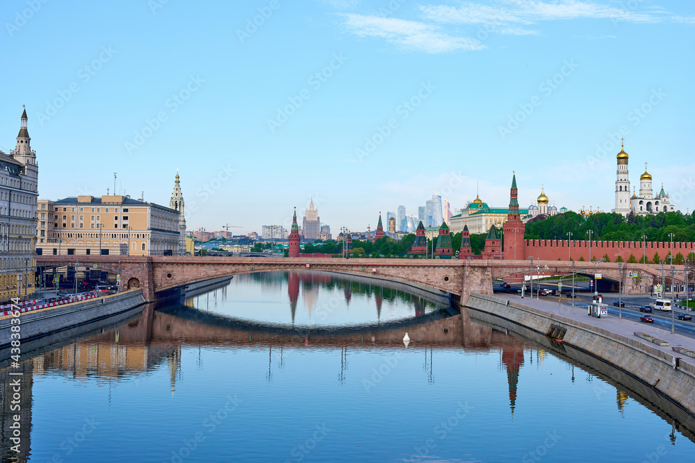 Panoramic landscape with view at embankment Moscow river and Kremlin with reflections in water.