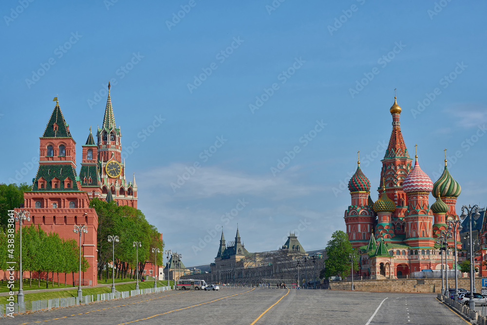 City landscape with view at Moscow Kremlin towers and St. Basil's Cathedral on Red square.