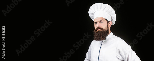 Portrait of a serious chef cook. Chef  cooks or baker. Bearded male chefs isolated on black. Cook hat. Serious cook in white uniform  chef hat