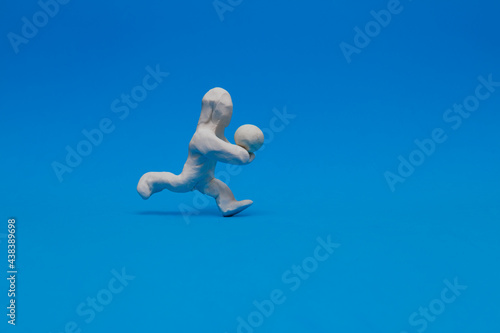 White modeling clay dummy practicing volleyball