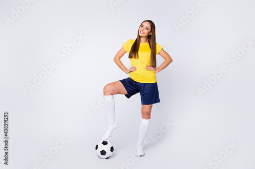 Full length body size view of her she nice-looking beautiful content successful cheerful cheery glad straight-haired girl playing soccer posing isolated over light white gray pastel color background