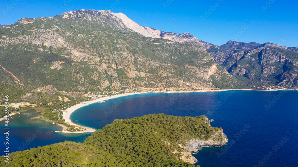 Ölüdeniz is a small neighbourhood and beach resort in the Fethiye district of Muğla Province, on the Turquoise Coast of southwestern Turkey, at the conjunction point of the Aegean and Mediterranean se