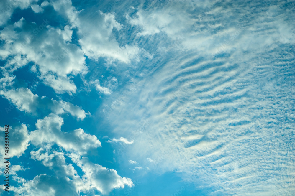 Beautiful clouds in a blue sky. Blue sky background. Beautiful clouds in a blue sky. Blue sky background.