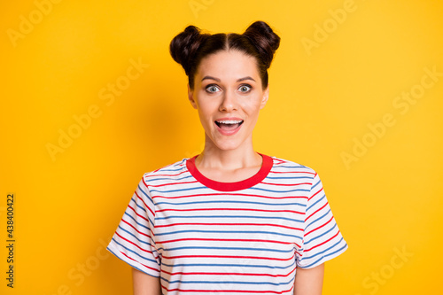 Photo of funny impressed young lady dressed striped outfit open mouth big eyes isolated yellow color background