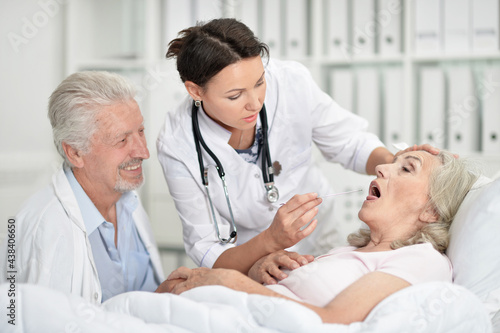 Senior woman in hospital with caring doctor