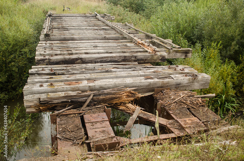 Old, abandoned railway bridge in Latvia photo