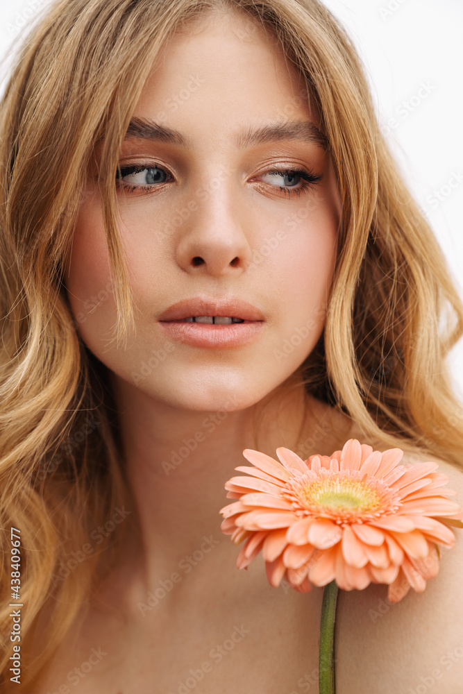 Half-naked ginger woman posing with gerbera flower Half-naked ginger woman posing with gerbera flower