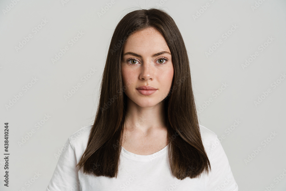 Young brunette woman posing and looking at camera Young brunette woman posing and looking at camera