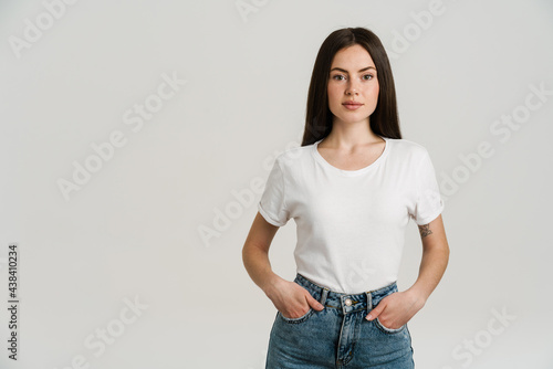Young brunette woman posing and looking at camera