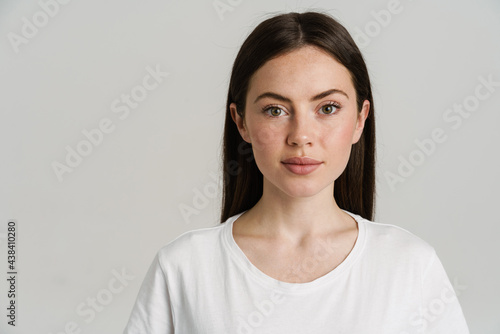 Young brunette woman posing and looking at camera