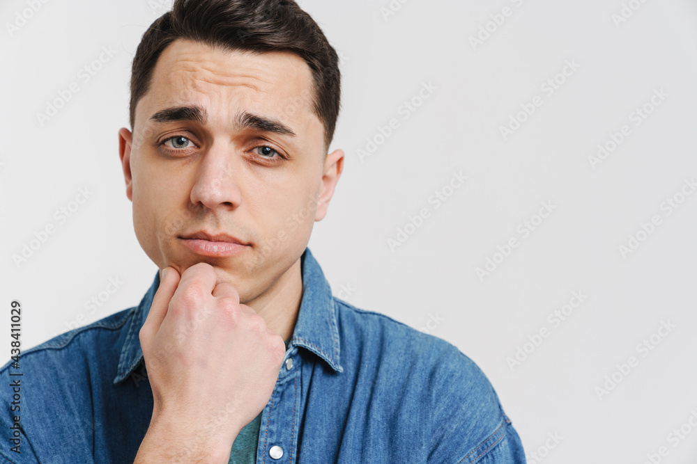 Young brunette white man posing and looking at camera Young brunette white man posing and looking at camera