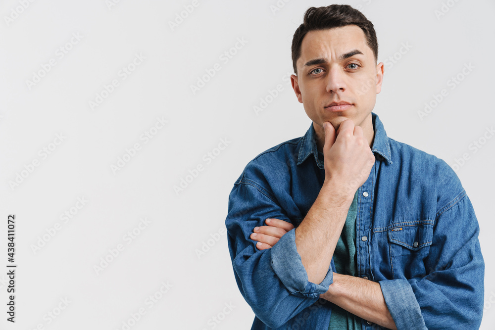 Young brunette white man posing and looking at camera Young brunette white man posing and looking at camera