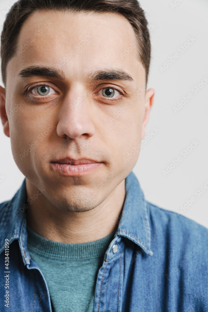 Young brunette white man posing and looking at camera Young brunette white man posing and looking at camera
