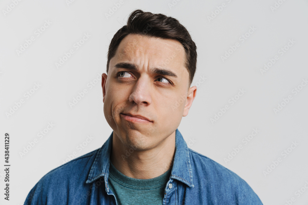 Fototapeta premium Young brunette white man posing and looking aside