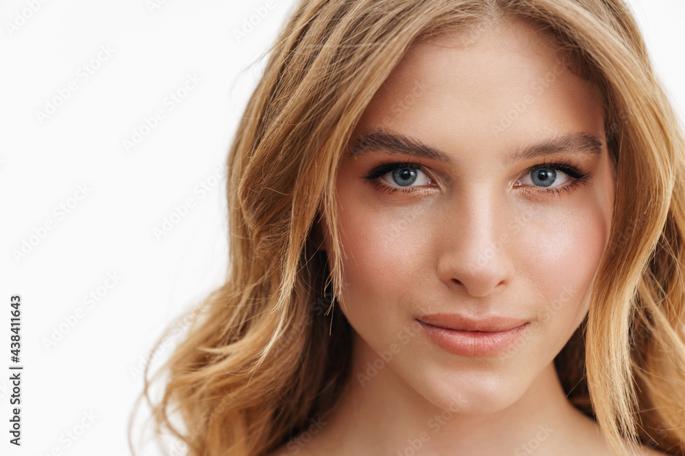 Half-naked curly woman posing and looking at camera Half-naked curly woman posing and looking at camera