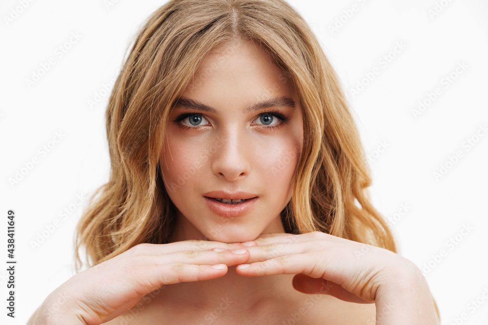 Half-naked curly woman posing and looking at camera Half-naked curly woman posing and looking at camera