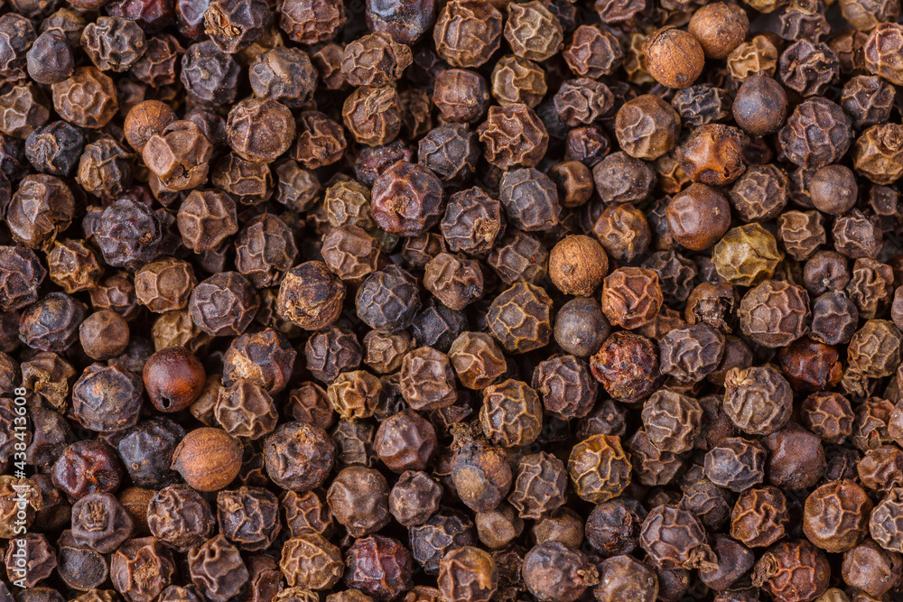 Large pile of allspice peas. Food background.Background made of middle