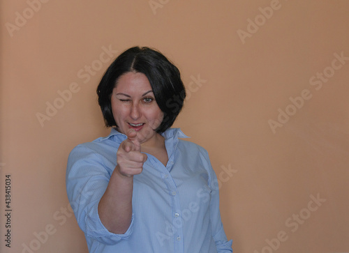 Portrait of a girl on a light background. Emotions