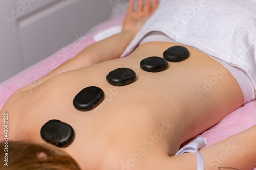 facial and body foot massage procedure in the spa salon