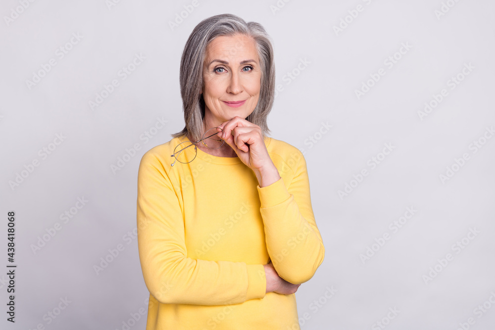 Photo of thoughtful minded beautiful positive mature woman thinking brainstorming isolated on grey color background