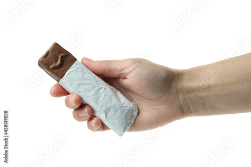 Female hand holds candy bar, isolated on white background