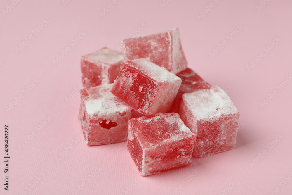 Delicious turkish delight cubes on pink background Delicious turkish delight cubes on pink background