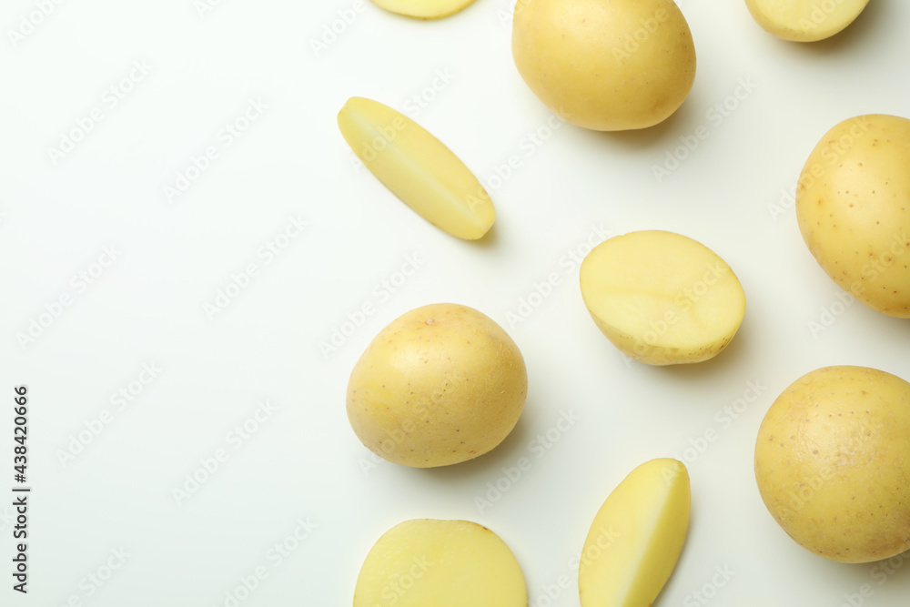 Tasty young potato on white background, top view Tasty young potato on white background, top view