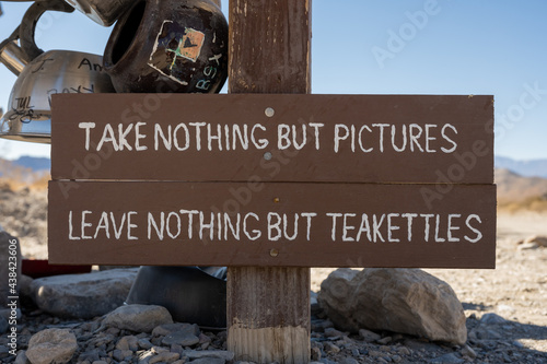 Take Nohting But Pictures Sign At Teakettle Junction photo