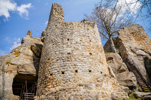 Medieval gothic castle Frydstejn in sunny day, romantic ruins of popular stronghold with massive round guard tower near Mala Skala, ancient fortress, Bohemian Paradise, Czech Republic photo