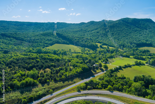 Panoramic aerial view of summer green trees forest of highway junction road in Daleville town, Virginia USA photo