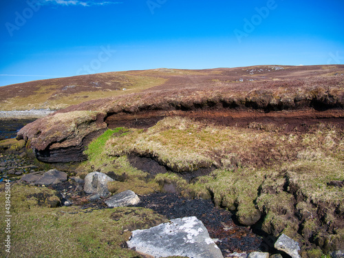 Fototapeta Peat erosion and loss from old peat diggings on coastal wetlands at Lunna Ness, Shetland, UK