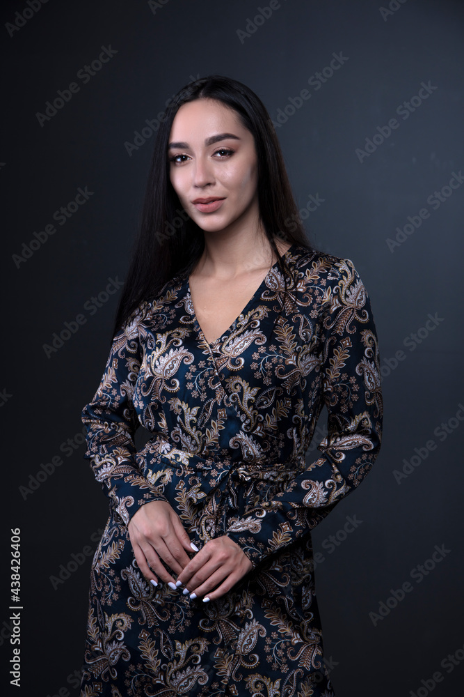 portrait of a young woman in the studio on a dark background portrait of a young woman in the studio on a dark background