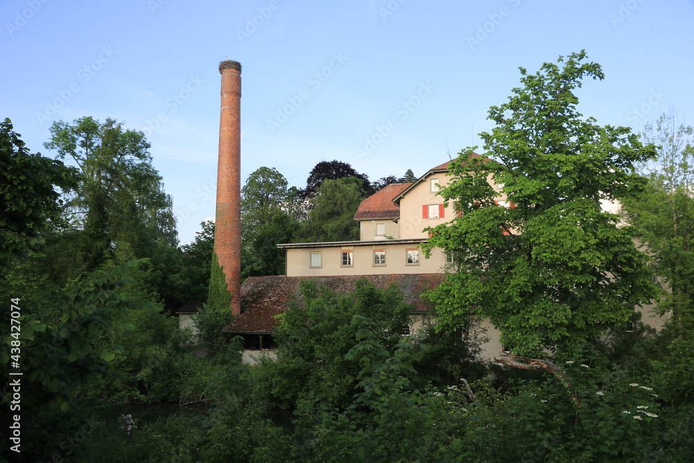 Schoenau, old factory in Wetzikon, Zurich. Beautiful old chimney with a storks nest on top.