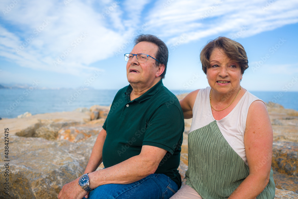 lifestyle portrait of loving happy and sweet mature couple - senior retired husband and wife on 70s enjoying beach walk relaxed and cheerful celebrating love together