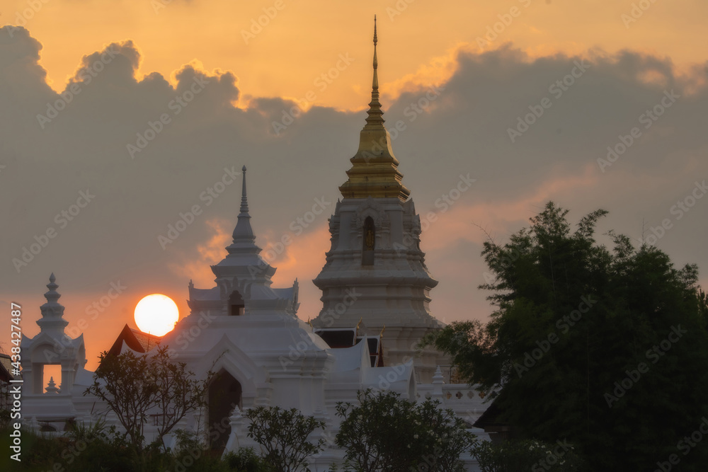 Sunset at a pagoda in Chaiyaphum province in Thailand.