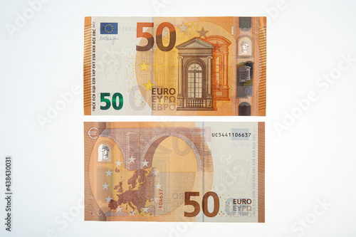 Both sides of a fifty euro banknotes on a white background