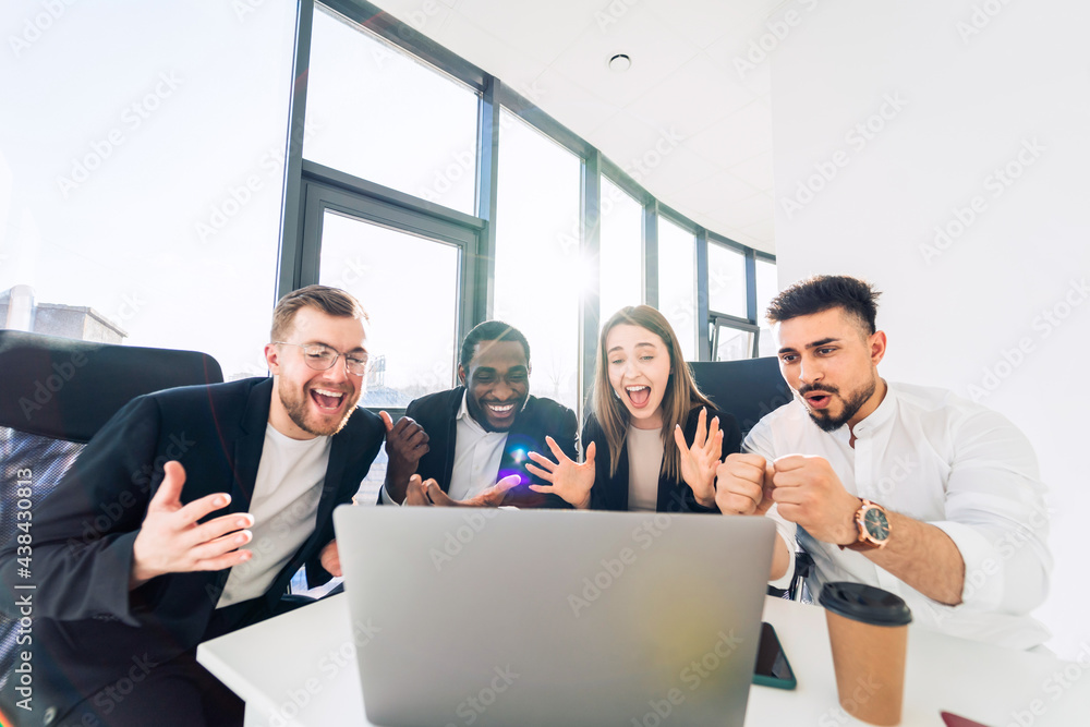 Obraz premium Group of multiracial finance company employees celebrate the company's success