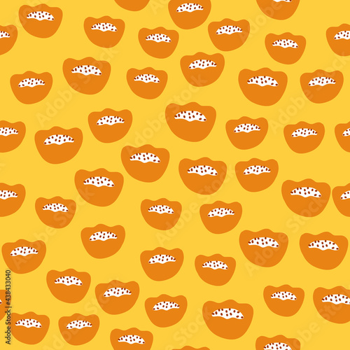 Scandinavian seamless pattern with random little orange abstract kids figures print. Yellow background.